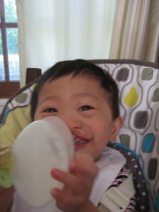 Once again, proving that it'snext to impossible to photograph this kid without him smiling. Look Mama! No pacifier!