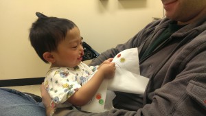 In pre-op, Alexander reads his good luck card from his Godbrother Josh. His Godfather Adam and his son Josh dropped the card off the night before his surgery.